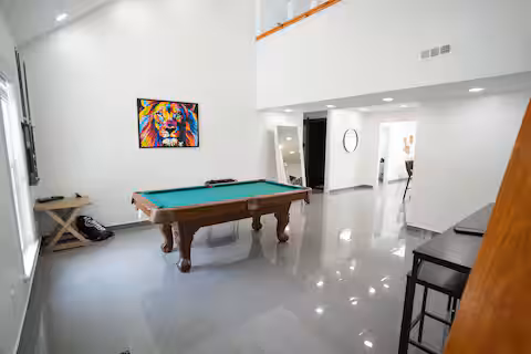Game room with billiards at Rimrock, a Bello Homes managed short-term rental