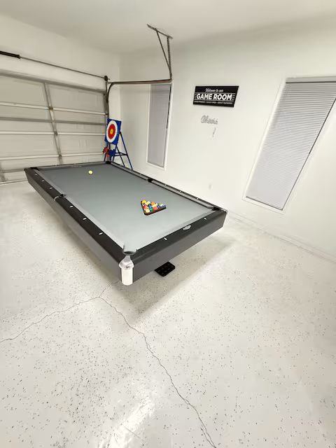 Game room with billiards at Riverport, a Bello Homes managed short-term rental