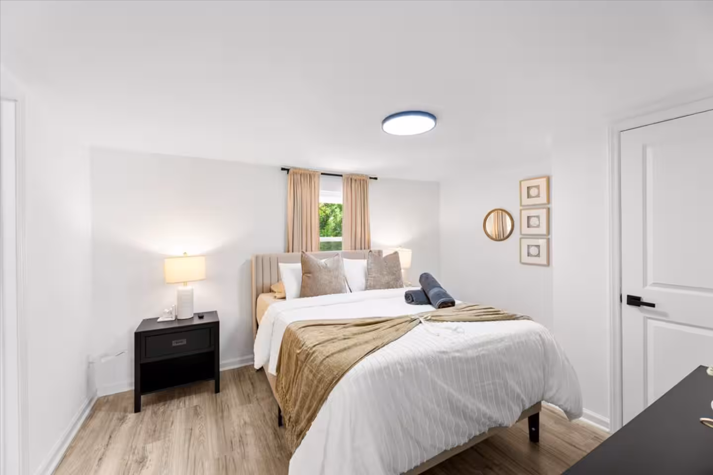 Designer-styled bedroom at the Stone House, a Bello Homes managed short-term rental